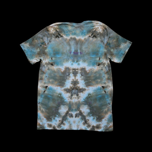 Back of the same tee showing an abstract ice-dye pattern in slate blue, brown, gray, and cream.