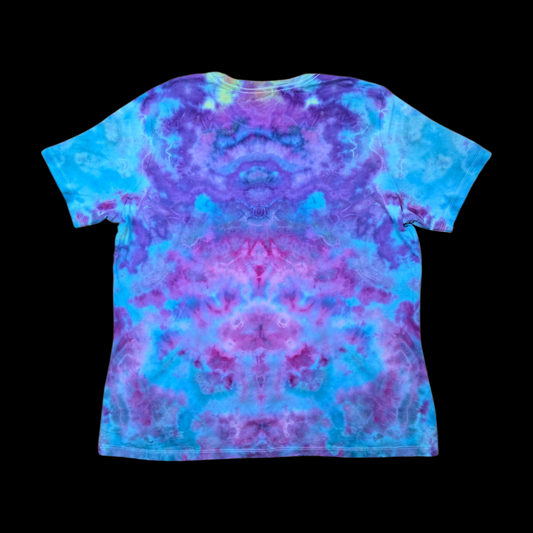 A short-sleeve crewneck t-shirt with a vibrant tie-dye pattern in shades of blue, purple, and pink, displayed flat against a solid black background.