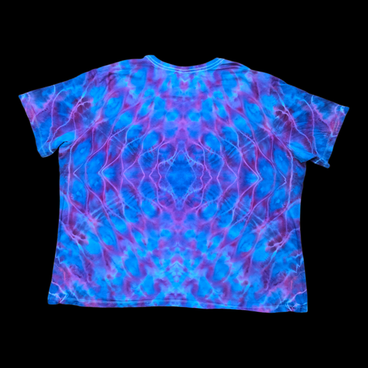 Back of the same tee showing a mirrored rolled mandala in blue, purple, and pink.