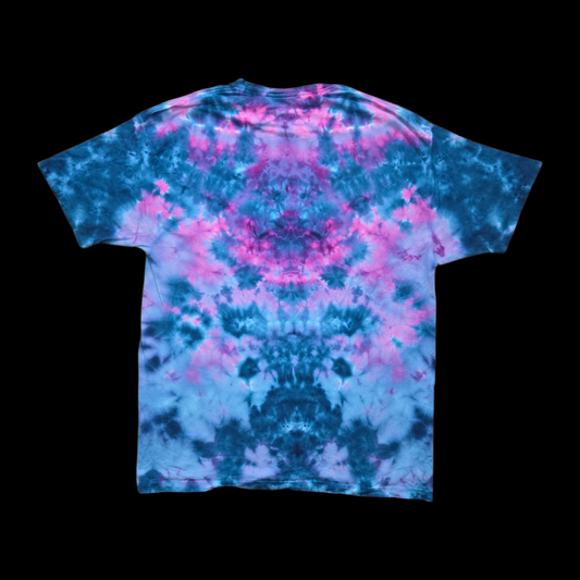 Back of the tee with an all-over ice-dye wash of pink, magenta, teal, and blue in a mirrored cloudy pattern.