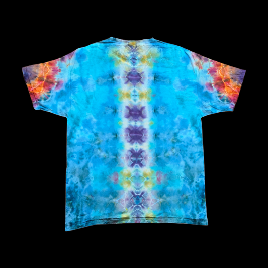 Back of a tie-dye tee with a vertical spine pattern in purple, yellow, and gold over turquoise and blue, with orange and pink on the sleeves.