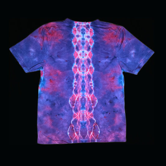 Back of the tie-dye tee showing a symmetrical blue and pink spine pattern down the center over purple.