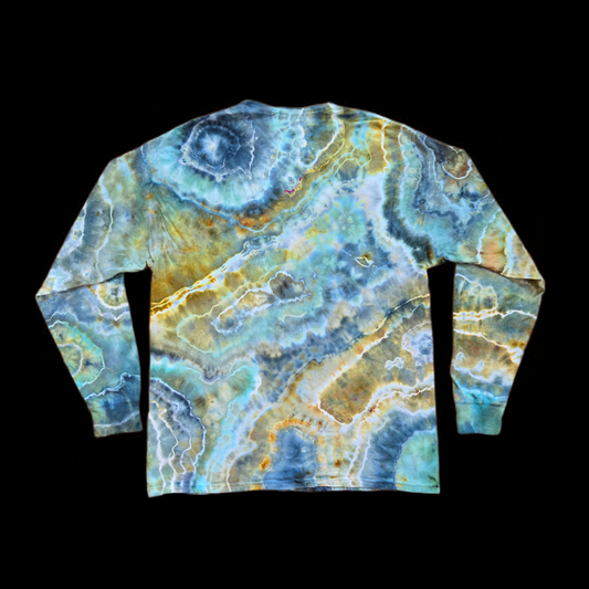 Back of the same long sleeve shirt showing ice dye geode banding with a large circular ring at the upper left shoulder and diagonal gold, olive, and blue-gray bands.