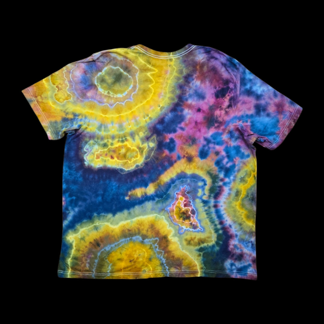 Back of the tie-dyed t-shirt showing marbled yellow rings with blue rivers and pink and purple bursts.