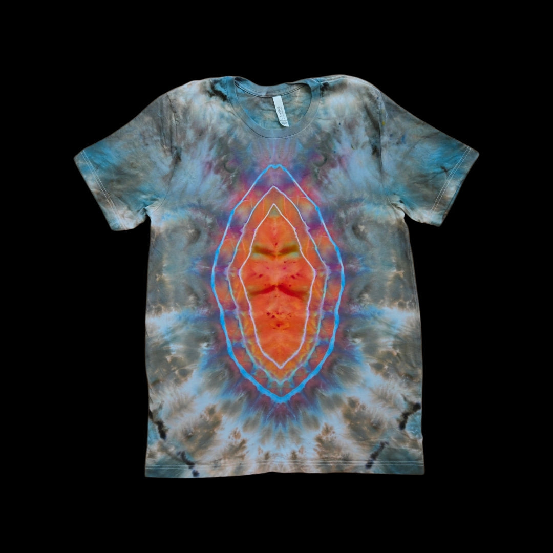 Front of a tie-dyed tee with a concentric geode design glowing orange and red at the center surrounded by blue and gray.