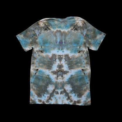 Back of the same tee showing an abstract ice-dye pattern in slate blue, brown, gray, and cream.