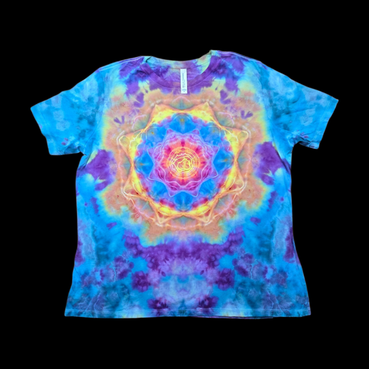 A short-sleeve crewneck tie-dye t-shirt featuring a large, vibrant mandala design in the center. The shirt is colored in a mix of blue, purple, yellow, and orange, and is displayed flat against a solid black background.
