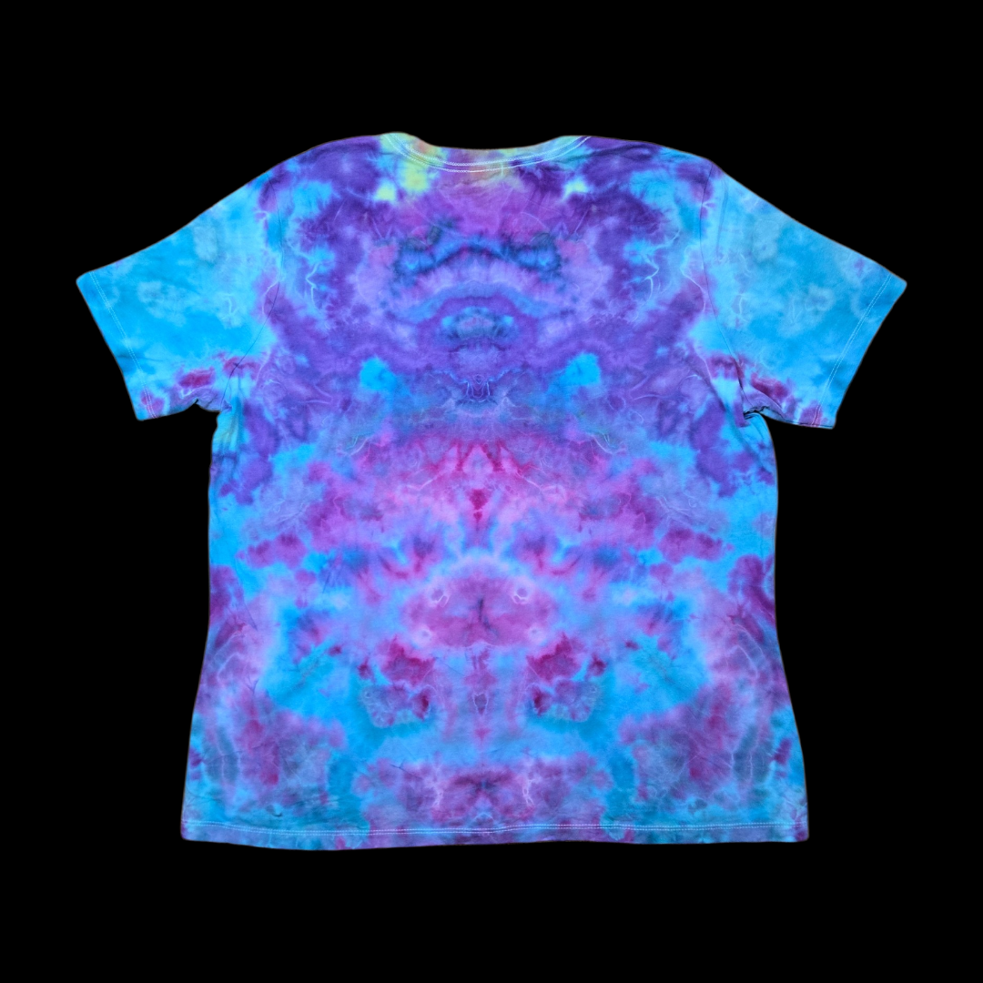 A short-sleeve crewneck t-shirt with a vibrant tie-dye pattern in shades of blue, purple, and pink, displayed flat against a solid black background.