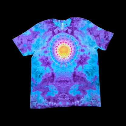 Front of a tie-dye tee with a yellow, orange, and pink sunburst mandala on the chest surrounded by purple and blue.