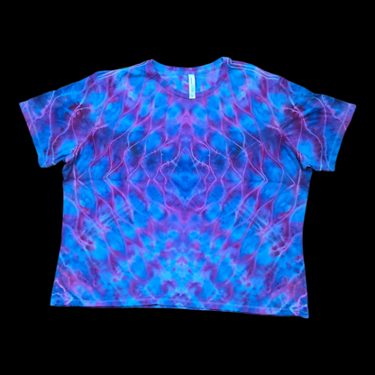 Front of a blue and purple rolled mandala tie-dye women's relaxed tee on a black background.