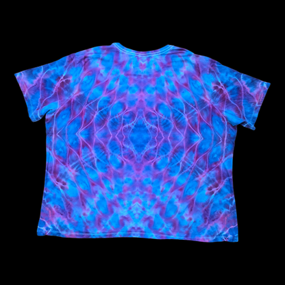 Back of the same tee showing a mirrored rolled mandala in blue, purple, and pink.