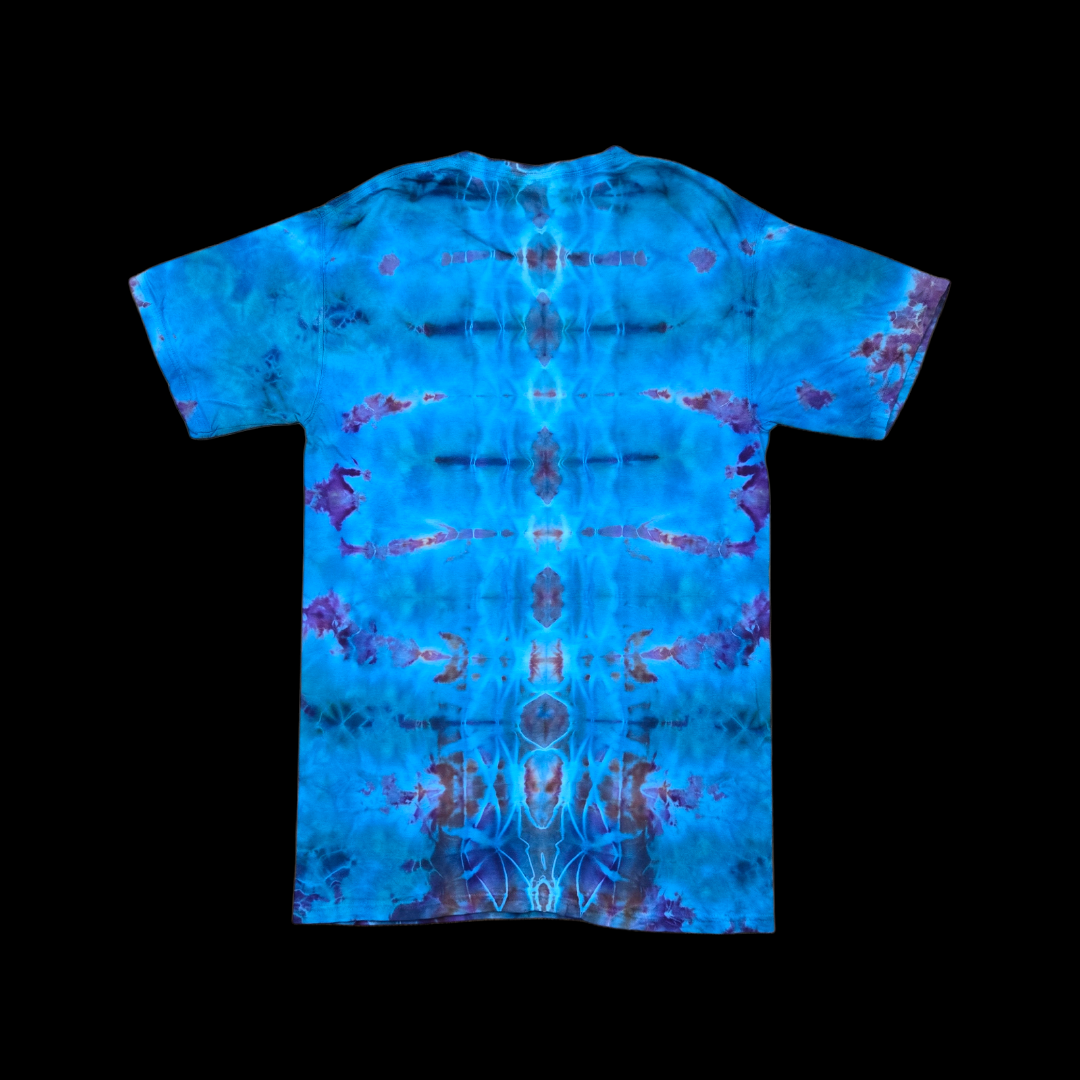 Back of the tee showing blue, purple, and rust ice-dye bursts mirrored symmetrically down the center.