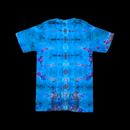 Back of the tee showing blue, purple, and rust ice-dye bursts mirrored symmetrically down the center.