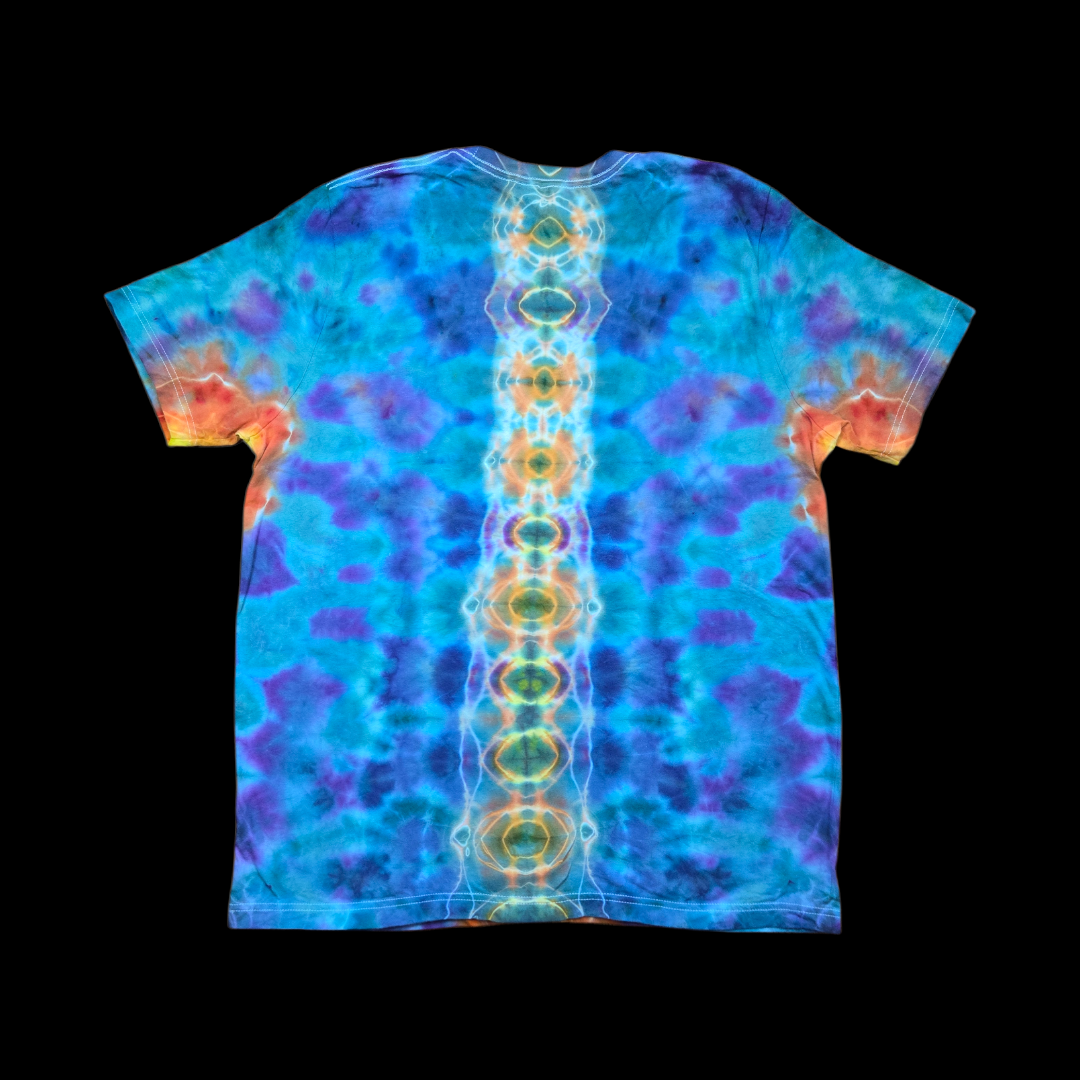 Back of the tie-dyed T-shirt showing a vertical spine of orange and gold geode ovals against turquoise, blue, and purple ice dye.
