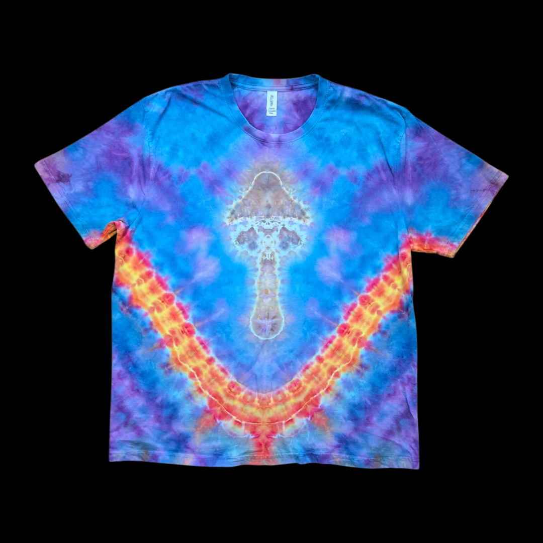 Front of a blue and purple tie-dye tee with an ice-dyed mushroom and an orange, red, and yellow V-sunburst.
