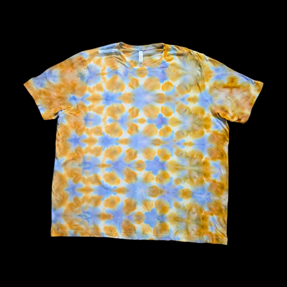 Front of a hand dyed unisex tee with a repeating grid of gold and amber rounded cells separated by pale periwinkle blue lines on an off-white background.