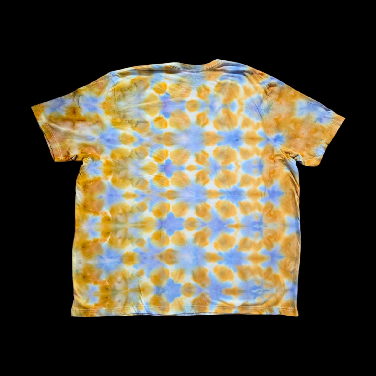 Back of the same tee showing the same repeating gold cell grid with periwinkle blue lines forming star-shaped intersections across the shoulders and center.