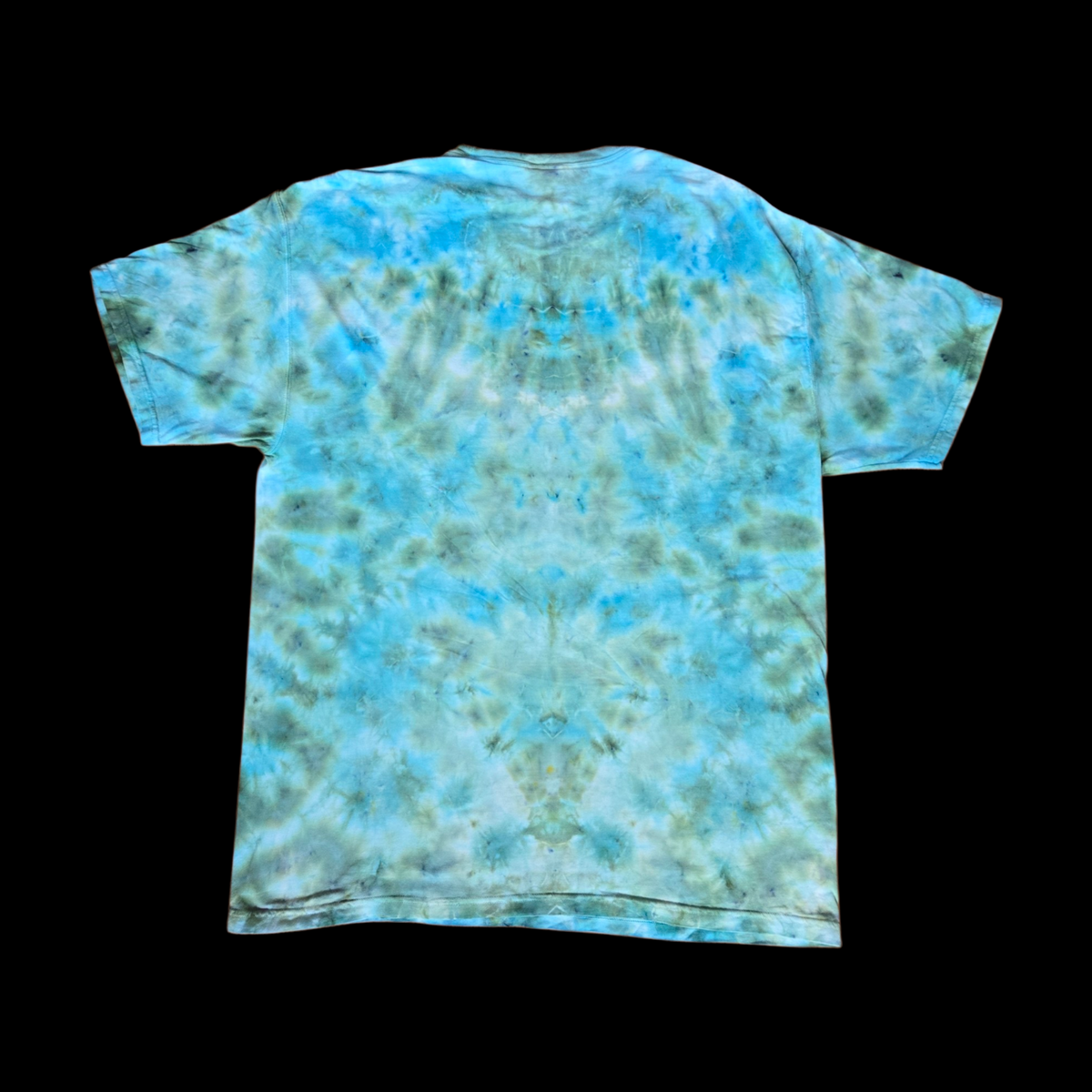 Back of the tee with an allover mottled ice-dye pattern in turquoise, teal, olive green, and light gray.