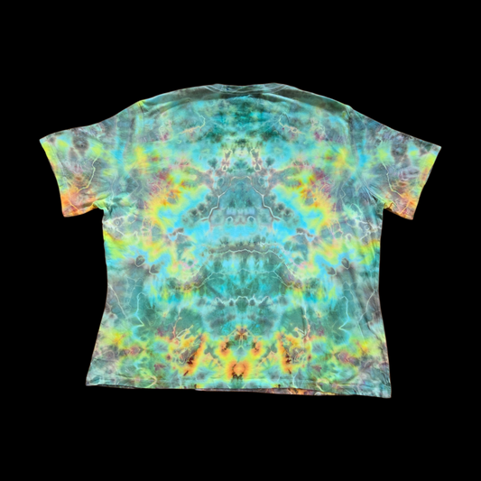 Back of the tie-dyed tee showing an all-over mirror-symmetrical ice dye pattern in blue, green, yellow, and gray with orange and red accents.