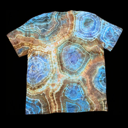 Back of the same t-shirt showing large circular geode formations in aqua, tan, and rust with white outlines.