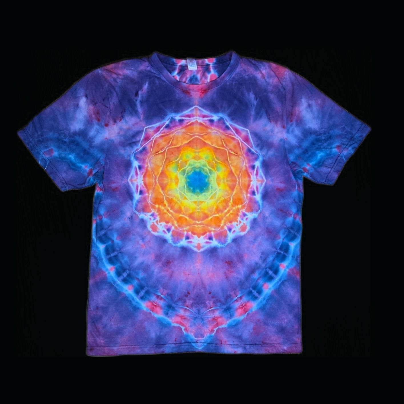 Front of a purple and blue tie-dye tee with a rainbow mandala centered on the chest.