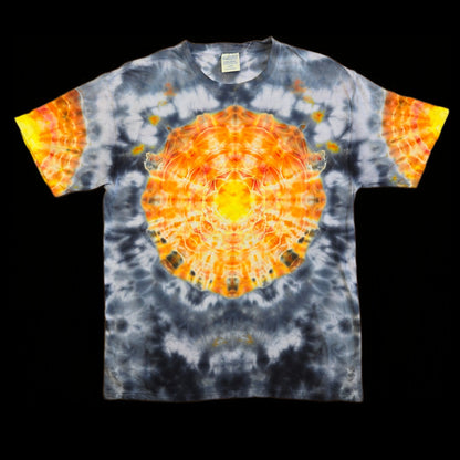 Front of shirt displays a radial mandala pattern in orange and yellow with white highlights, centered on a gray and black tie-dye field.